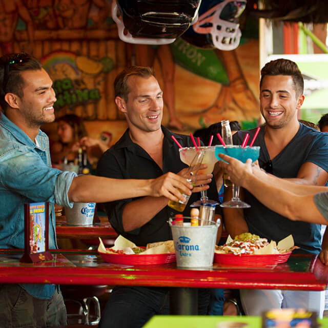 Friends toast with jumbo cocktails in West Hollywood, California