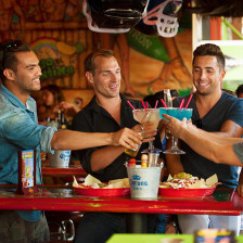 Friends toast with jumbo cocktails in West Hollywood, California